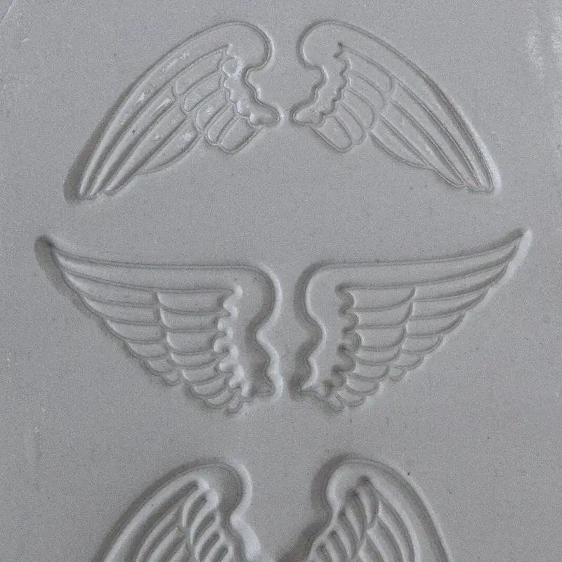 Embossed Texture Tile With Organic Wing Pattern 1
